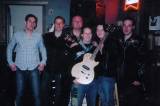 Eastern Band with fan Rebecca Hardy and friend with prize guitar, later to be given away through contest on web site
